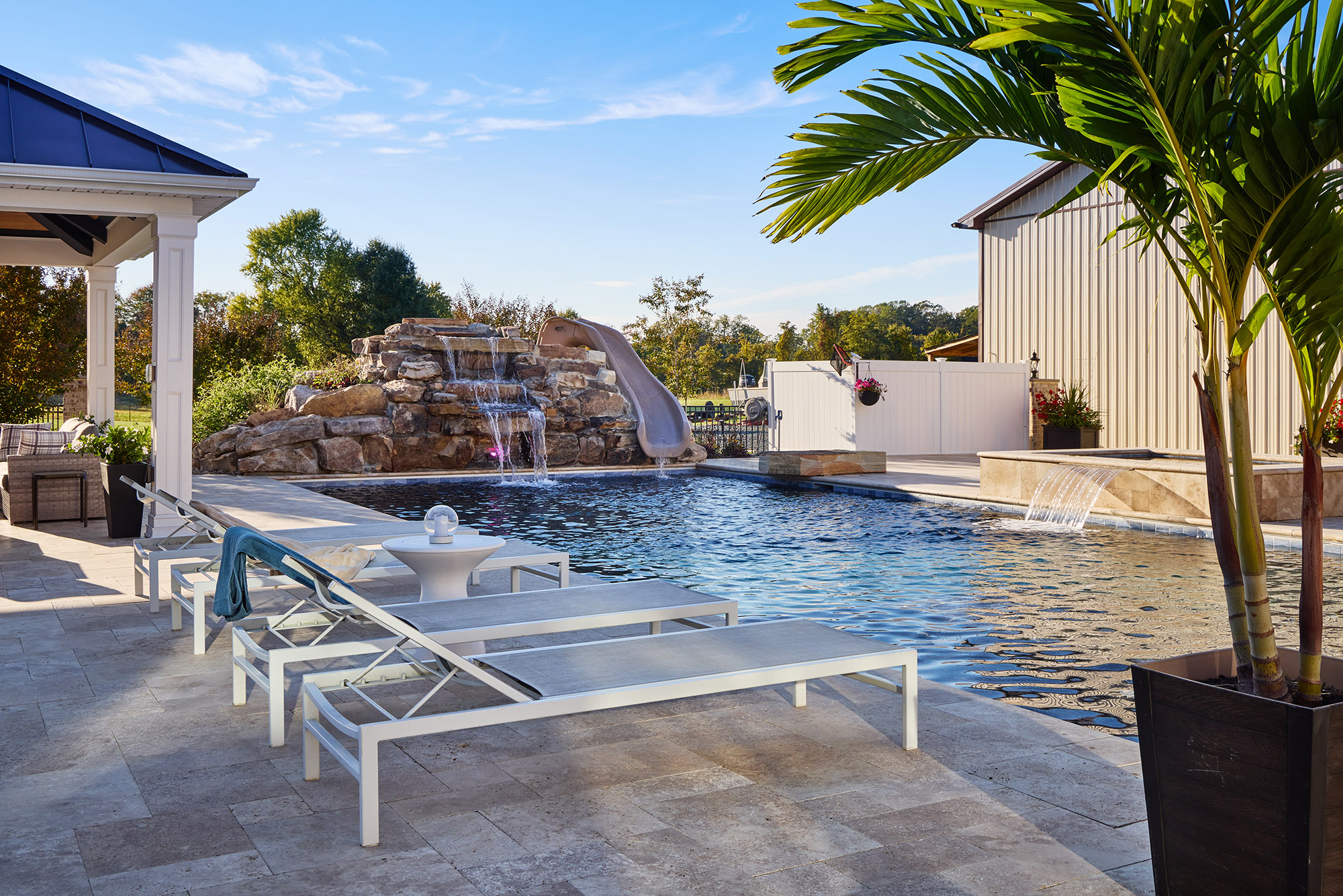 sit out by the custom in ground pool build and designed by lazo